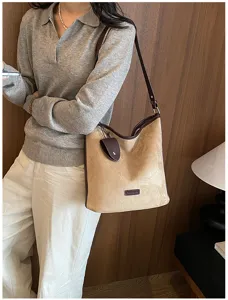 Vintage suede shoulder bag for women, chic brown commuter bucket bag with stylish leather trim.