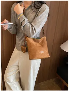 Brown suede bucket bag for women, stylish vintage cross-body shoulder bag for daily commute.