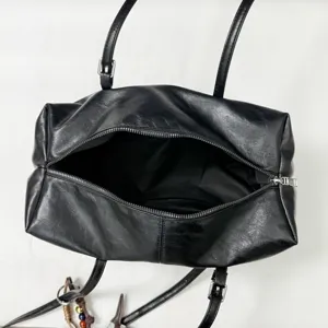 Black casual commuting large capacity women shoulder handbag tote pillow bag detail view.
