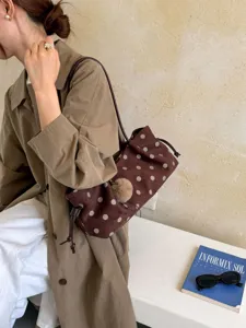 Brown polka dot shoulder bag for women, vintage casual tote bag with plush ball charm.