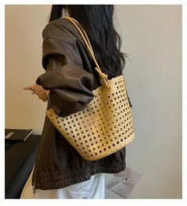 Detailed view of women fashion cutout woven shoulder bag large capacity commuting tote.