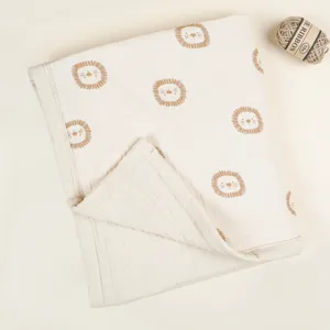 Thickened four-layer cotton baby blanket with cute lion prints, soft and breathable swaddle.