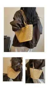 Detailed view of the stylish yellow woven tote bag showcasing multiple carrying angles and design.