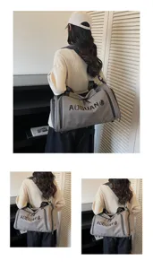 Detail view of the PU gym travel duffel bag with a model, showing shoulder carry style.