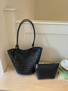 Chic black woven leather tote bag set with matching pouch, stylish large capacity shoulder bag.
