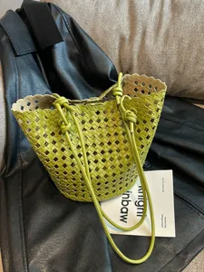 Stylish green woven bucket bag for women, large capacity shoulder and tote bag for summer.