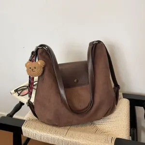 Brown suede shoulder bag for women vintage hobo handbag casual crossbody tote with bear charm.