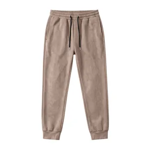 Detailed view of men brown suede fleece joggers, elastic drawstring waist and cuffed hem.