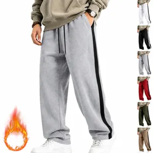 Close-up detail of thick fleece-lined men sweatpants with side stripe and warm winter cozy fit.