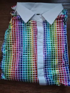 Men colorful sequin disco shirt detail, white turn-down collar, retro stage performance top.