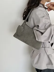 Grey suede shoulder bag detail showing sub bag and strap texture design for daily wear.