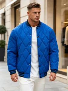 Detailed view of the blue quilted bomber jacket showing its button closure and rib knit.