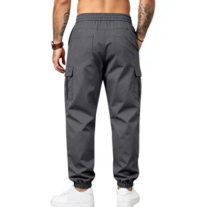 Men's dark gray cargo trousers featuring multiple pockets, cuffed hems and elastic waist.