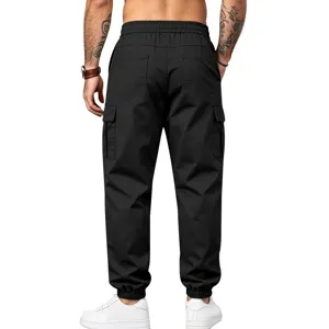 Men's black multi-pocket cargo pants featuring cuffed ankles and durable twill fabric detail.