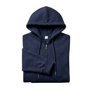 Men's waffle knit quarter zip hoodie detail, casual navy blue sweatshirt with pouch pocket.