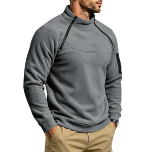 Close-up van het grijze heren fleeceshirt met halve rits, zachte textuur en raglanmouwen.