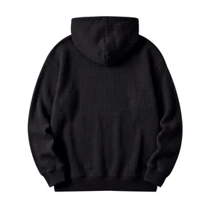 Detailed back view of men's black waffle knit hoodie showcasing texture and hood design.