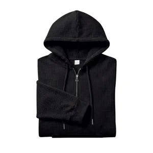 Men black waffle knit half zip hoodie, casual hooded sweatshirt with drawstring detail.