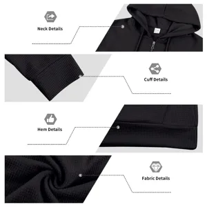 Detailed view of the black waffle knit hoodie showcasing the collar, zipper, and cuff texture.