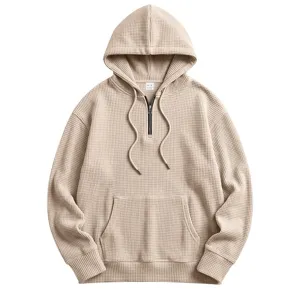 Men waffle half-zip hoodie detail view, showing kangaroo pocket and textured collar.