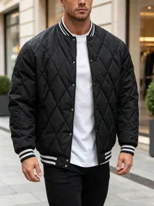 Detailed view of men's black quilted bomber jacket featuring stylish striped ribbed cuffs and collar.