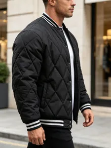 Close-up detail view of men quilted bomber jacket, black diamond pattern with striped collar.