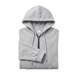 Men's waffle knit half-zip hooded sweatshirt with front pocket and adjustable drawstring.