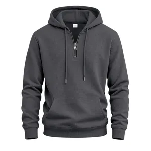 Dark grey men's waffle knit half zip hoodie with front pocket, drawstring hood and cuffs.