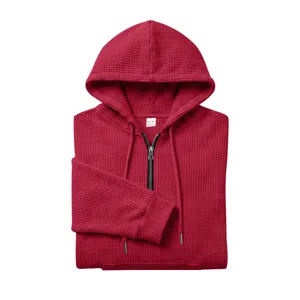 Men's waffle half-zip hooded sweatshirt in red, featuring a cozy hood and convenient front pocket.