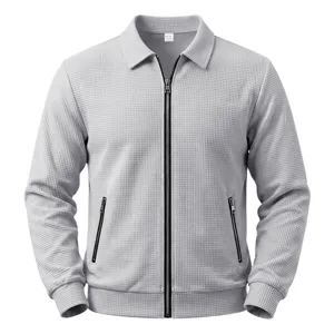 Detail shot of men grey waffle knit zip jacket, collar and zipper pocket closeup view.