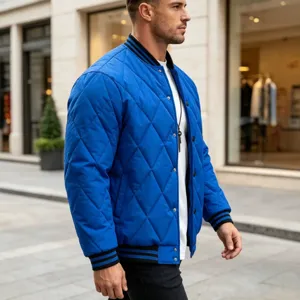 Men's royal blue quilted bomber jacket casual outerwear with snap button closure.
