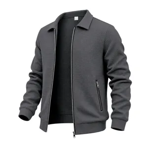 Detail view of dark grey waffle knit men jacket zipper collar texture close-up apparel.