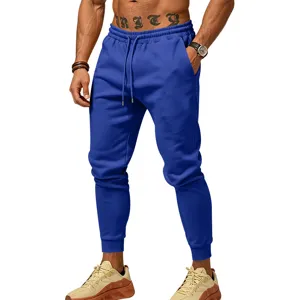 Men's solid color cuffed sweatpants with elastic drawstring waist for casual jogging sports.