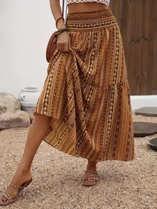 Bohemian print maxi skirt detail, elastic high waist, vintage tiered boho clothing style.