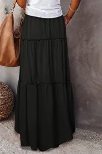 Detailed view of women's black tiered long skirt with high waist and ruffle hem design.