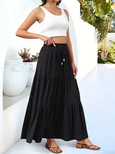 Casual white crop top and black tiered maxi skirt set perfect for summer vacation.
