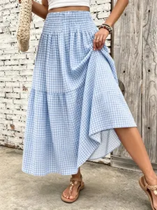 Detailed view of blue and white gingham maxi skirt with elastic high waist and tiered hem.