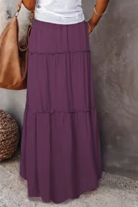 Detailed view of women's purple tiered maxi skirt with layered ruffles and high waist design.