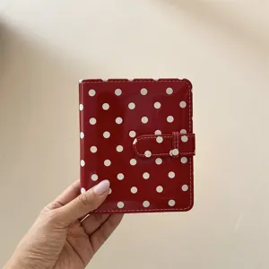 Red polka dot photo card binder detail, glossy PU leather mini photocard album holder with clasp.