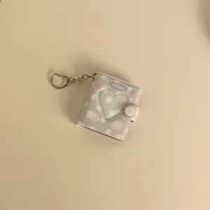 Mini photo album keychain with heart hollow and cute polka dots for 2-inch photo storage.