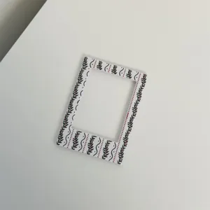 Close-up detail view of 3-inch magnetic photo frame featuring Christmas berry plant pattern.