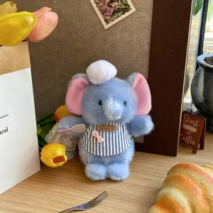 Süßes blauer Elefant Plüschtier Koch Puppe mit gestreifter Schürze und Spatel für Dekoration.