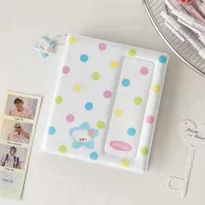 Detail view of Korean style polka dot photocard binder with cute star charm and pocket slot.