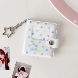 Mini transparent polka dot photo album card holder with star keychain for K-pop idol cards.