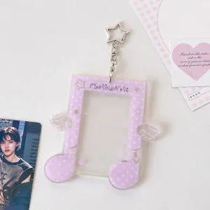 Acrylic star photocard holder with purple polka dot design, cute backpack accessory.