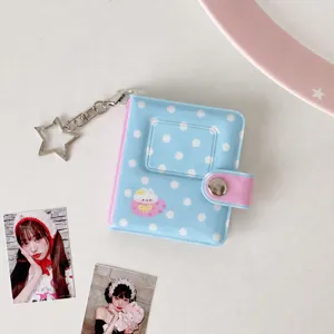 Mini polka dot photo album keychain card holder detail close up, cute Korean style display.