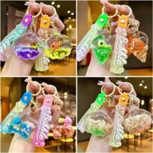 Close-up detail of creative liquid shell keychain with floating toy inside and bubble strap.
