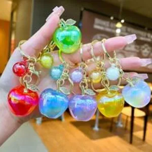 Colorful gradient apple keychain and bag charm, cute accessory for car keys and backpacks.