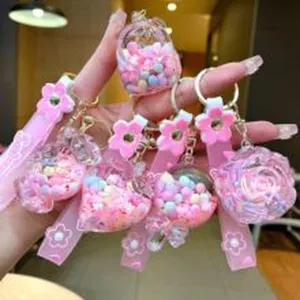 Cute liquid floating bead keychain pink flower strap charm bag pendant cute gift