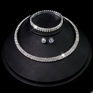 Detailed view of rhinestone jewelry set featuring necklace, bracelet and earrings.